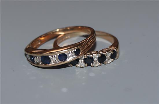 Two 9ct gold, sapphire and diamond set half hoop rings.